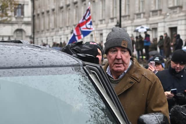British TV host and farmer Jeremy Clarkson leaves after delivering a speech on stage during a farmers' protest against changes to inheritance tax rules for land ownership, outside of Downing Street