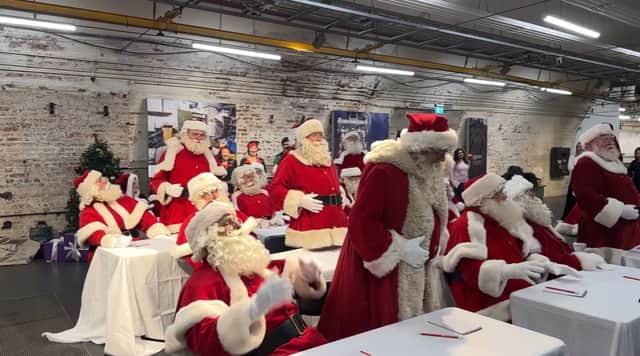Santas learn how to perfect that iconic chortle