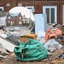 Before-and-after pictures show how a house of horrors which was turned into a makeshift dump has finally been cleared of rubbish after more than a year. 
