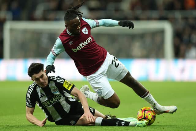 Wan-Bissaka is challenged by Tino Livramento.