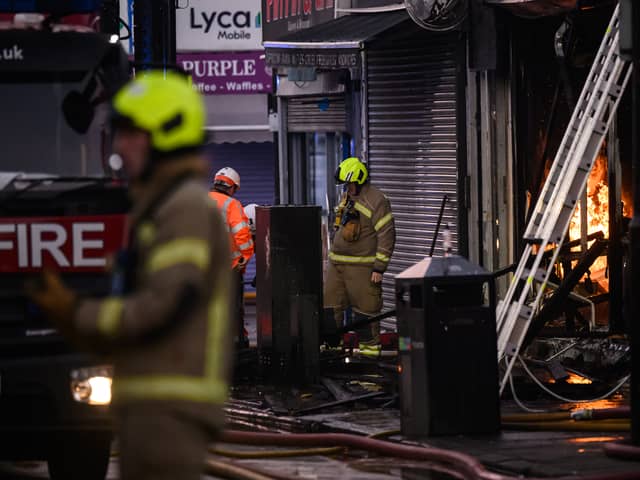 Firefighters tackle a blaze at a takeaway restaurant in North London