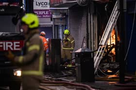 Firefighters tackle a blaze at a takeaway restaurant in North London