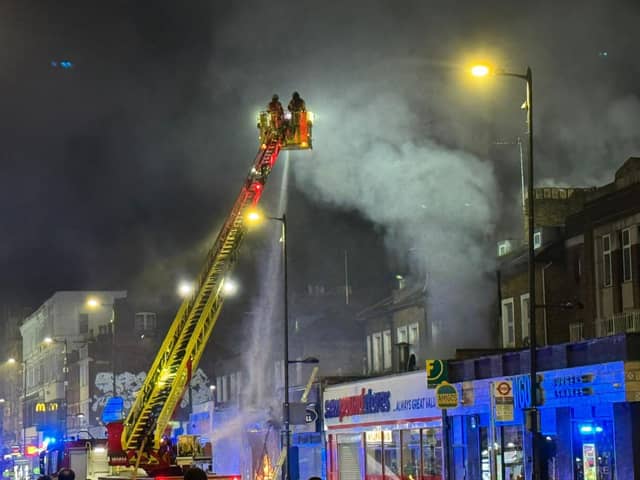 London Fire Brigade tackle a fire at a takeaway in Holloway. 