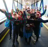 Carol singers take over Uk train station to spread important message