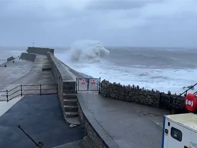 Huge waves crash into Porthcawl pier.