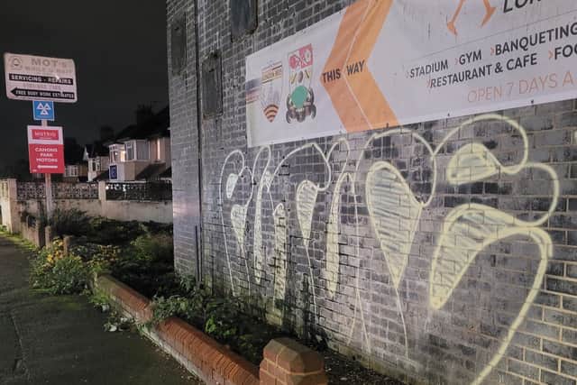 Residents want the graffiti outside Canons Park Station to be removed