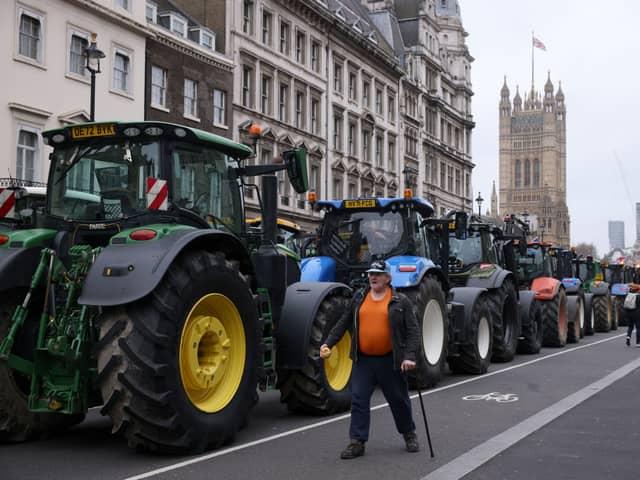 A parade of tractors lines up near Parliament 