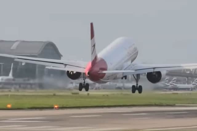 Planes land at Heathrow Airport in strong winds.