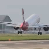 Planes land at Heathrow Airport in strong winds.