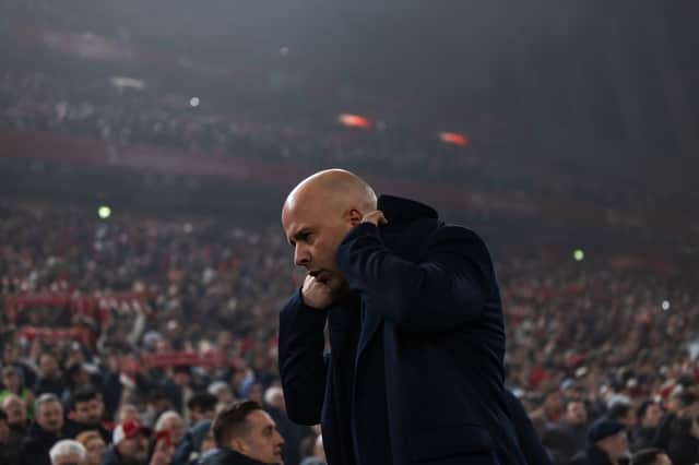 Arne Slot, head coach of Liverpool, looks down during the Premier League match between Liverpool FC and Leicester City FC at Anfield