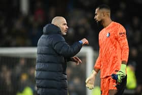 Chelsea's Italian head coach Enzo Maresca speaks with Chelsea's Spanish goalkeeper Robert Sanchez.