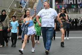 Fans of US mega-star Taylor Swift, gather outside Wembley Stadium in London on August 15, 2024