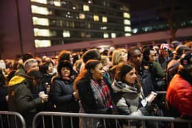 Ticket holders line up as they wait for access to enter Westminster Bridge for New Year firework celebrations