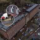 Car are flooded outside a newly converted Meadow Mill on Water street in Stockport as emergency teams arrive to rescue people trapped inside. January 1 2025.