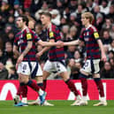 Anthony Gordon celebrates scoring against Spurs.
