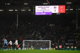 The LED screen displays a message from VAR which reads ""Decision No Goal, Offside, 11, Teodoro Martinelli Silva" during the Premier League match between Fulham FC and Arsenal FC at Craven Cottage on December 08, 2024 in London, England.