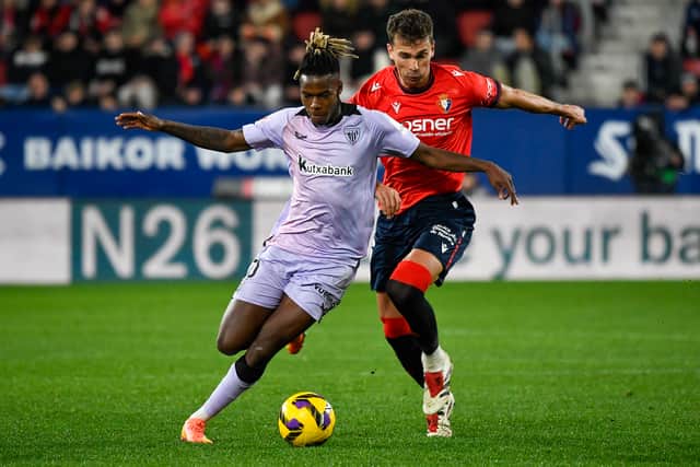 Athletic Bilbao's Spanish forward #10 Nico Williams (L) is challenged by Osasuna's Spanish midfielder #06 Lucas Torro Marset during the Spanish league football match between CA Osasuna and Athletic Club Bilbao at El Sadar stadium in Pamplona on December 21, 2024.