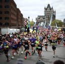 Fun runners cross Tower Bridge during the 2024 London Marathon 
