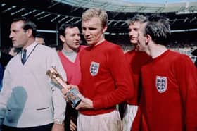 England captain Bobby Moore (1941 - 1993) with the Jules Rimet trophy, following England's 4-2 victory after extra time over West Germany in the World Cup Final at Wembley Stadium. 