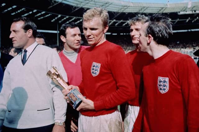 England captain Bobby Moore (1941 - 1993) with the Jules Rimet trophy, following England's 4-2 victory after extra time over West Germany in the World Cup Final at Wembley Stadium.