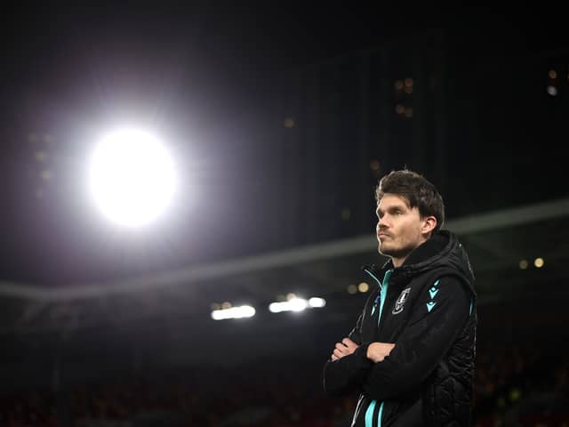 Danny Rohl, Manager of Sheffield Wednesday inspects the pitch prior to the Carabao Cup Fourth Round match between Brentford and Sheffield Wednesday at Gtech Community Stadium on October 29, 2024 in Brentford, England. 