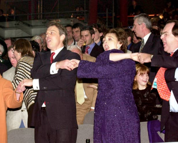 Queen Elizabeth II, Tony Blair, and his wife Cherie Blair during the Millenium New Year celebrations on December 31, 1999 at the Millennium Dome