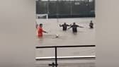 Lydney Town AFC players swim in flooded pitch