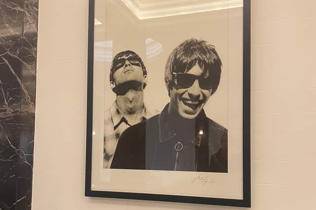 Photographs featuring Oasis adorned many of the walls in the public areas