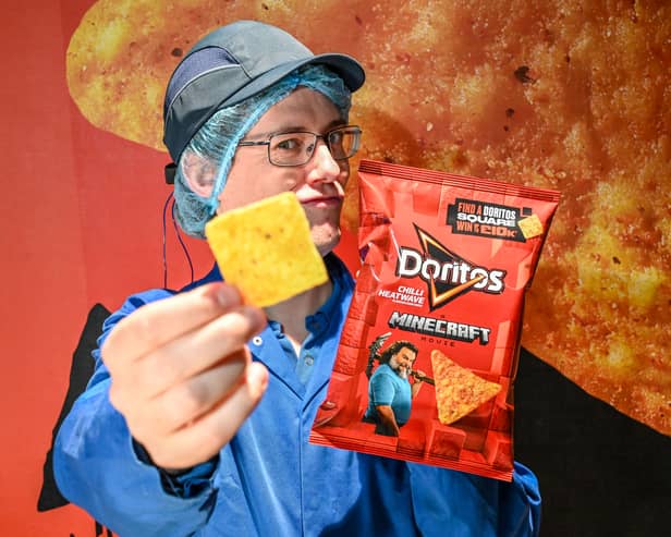Chief Chip Technician Dan Lynes inspects the world's first square Doritos