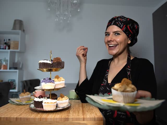 Photo of business owner with vegan cupcakes