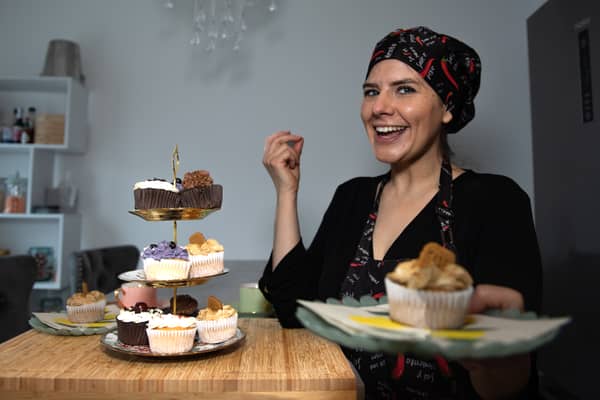Photo of business owner with vegan cupcakes