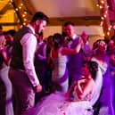 A bride given less than six months to live after losing her leg to cancer made it down the aisle to marry her partner -for the second time. 