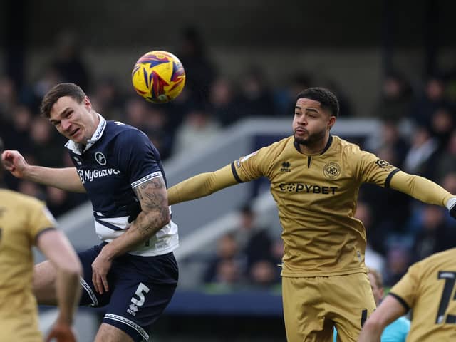 Jonathan Varane challenges Jake Cooper.