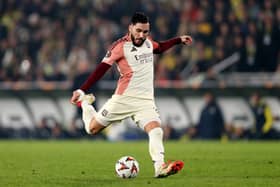Rayan Cherki of Olympique Lyonnais takes a shot during the UEFA Europa League 2024/25 League Phase MD7 match between Fenerbahce SK and Olympique Lyonnais at  on January 23, 2025 in Istanbul, Turkey