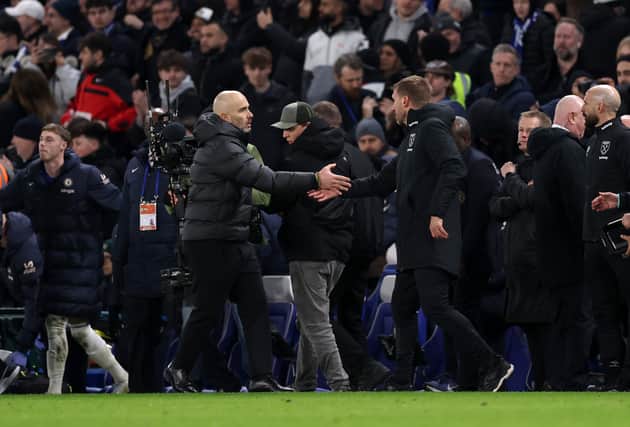 Enzo Maresca, Manager of Chelsea, and Graham Potter, Head Coach of West Ham United, shake hands following the Premier League match between Chelsea FC and West Ham United FC at Stamford Bridge on February 03, 2025 in London, England.