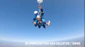 A 102-year-old lady skydiving with an instructor