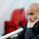 Pep Guardiola, Manager of Manchester City, looks on prior to the Premier League match between Liverpool FC and Manchester City FC at Anfield on December 01, 2024 in Liverpool, England. 