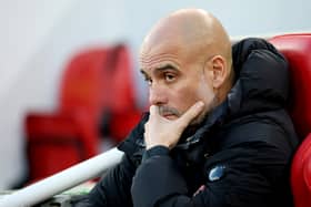 Pep Guardiola, Manager of Manchester City, looks on prior to the Premier League match between Liverpool FC and Manchester City FC at Anfield on December 01, 2024 in Liverpool, England. 