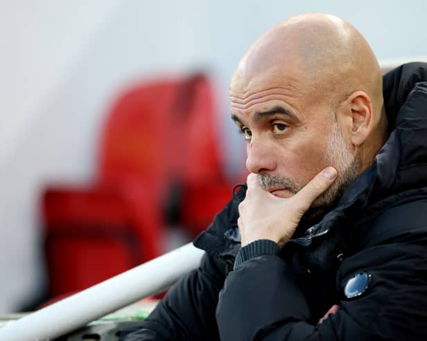 Pep Guardiola, Manager of Manchester City, looks on prior to the Premier League match between Liverpool FC and Manchester City FC at Anfield on December 01, 2024 in Liverpool, England. 