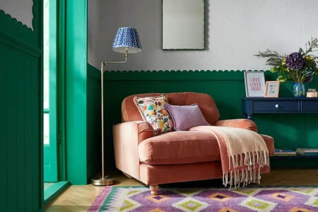 The Sophie Robinson Candy Kilim Wool Rug adds even more colour to this brightly hued space