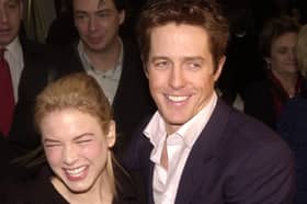 Actress Renee Zellweger hugs actor Hugh Grant at the premiere of "Bridget Jones's Diary" April 2, 2001 in New York City.