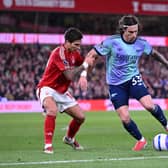 Riccardo Calafiori of Arsenal takes on Nicolas Dominguez of Forest during the Premier League match between Nottingham Forest FC and Arsenal FC at City Ground on February 26, 2025 in Nottingham, England. 
