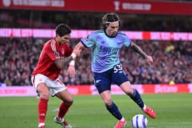 Riccardo Calafiori of Arsenal takes on Nicolas Dominguez of Forest during the Premier League match between Nottingham Forest FC and Arsenal FC at City Ground on February 26, 2025 in Nottingham, England. 