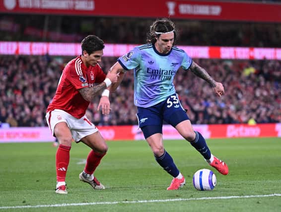 Riccardo Calafiori of Arsenal takes on Nicolas Dominguez of Forest during the Premier League match between Nottingham Forest FC and Arsenal FC at City Ground on February 26, 2025 in Nottingham, England.
