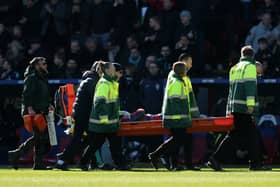 Jean-Philippe Mateta is stretchered off against Millwall.