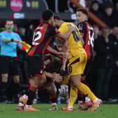 Matheus Cunha of Wolverhampton Wanderers clashes with Milos Kerkez of AFC Bournemouth, resulting in a red card being awarded during the Emirates FA Cup Fifth Round match between AFC Bournemouth and Wolverhampton Wanderers at Vitality Stadium on March 01, 2025 in Bournemouth, England.