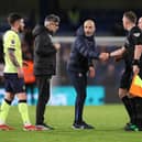 Enzo Maresca, Manager of Chelsea, shakes hands with Assistant Referee Scott Ledger as Ivan Juric, Manager of Southampton, looks on during the Premier League match between Chelsea FC and Southampton FC at Stamford Bridge on February 25, 2025 in London, England. 