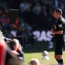 Match Referee Michael Oliver reviews an incident on the pitch side VAR monitor which resulted in a red card decision during the Emirates FA Cup Fifth Round match between Crystal Palace and Millwall at Selhurst Park on March 01, 2025 in London, England. 