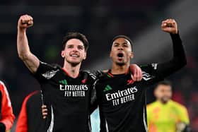 Declan Rice of Arsenal celebrates victory with teammate Gabriel after the UEFA Champions League 2024/25 UEFA Champions League 2024/25 Round of 16 first leg match between PSV and Arsenal FC at PSV Stadion on March 04, 2025 in Eindhoven, Netherlands