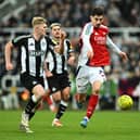 Kai Havertz of Arsenal and Lewis Hall of Newcastle United chase the ball during the Carabao Cup Semi Final Second Leg match between Newcastle United and Arsenal at St James' Park on February 05, 2025 in Newcastle upon Tyne, England. 
